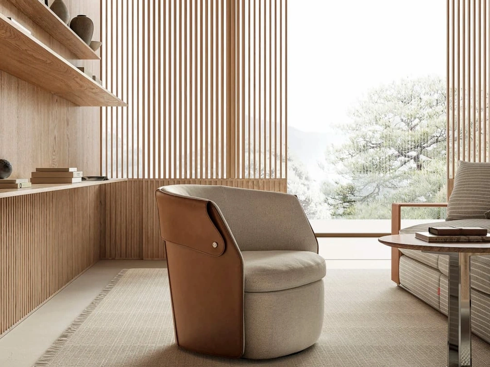 Poltroncina Ozzy in tessuto imbottito e cuoio di Flexform